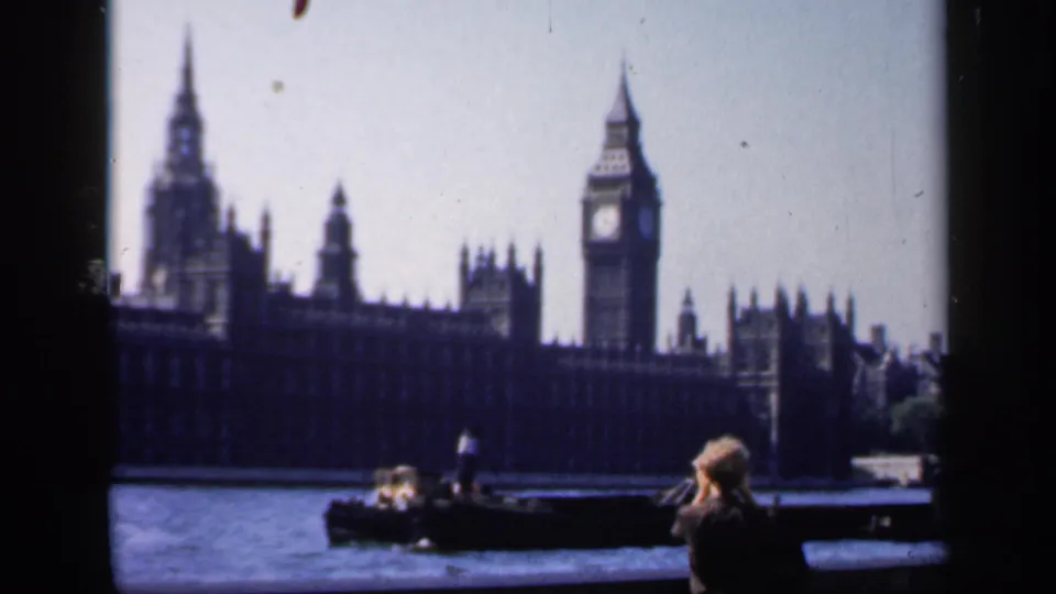 1949 London home-movie view of Big Ben and the Houses of Parliament from across the Thames, with tourists in the foreground.