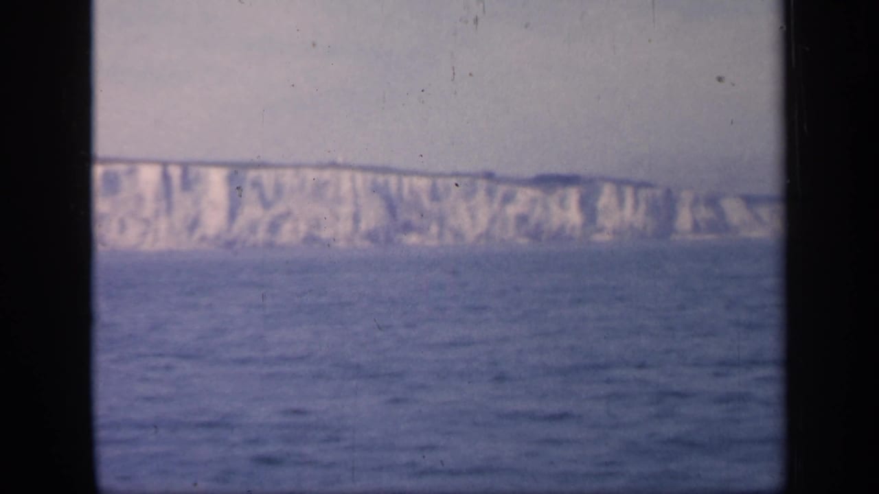 English white cliffs appear in a soft 8mm seascape, with open water in front and a pale sky above.