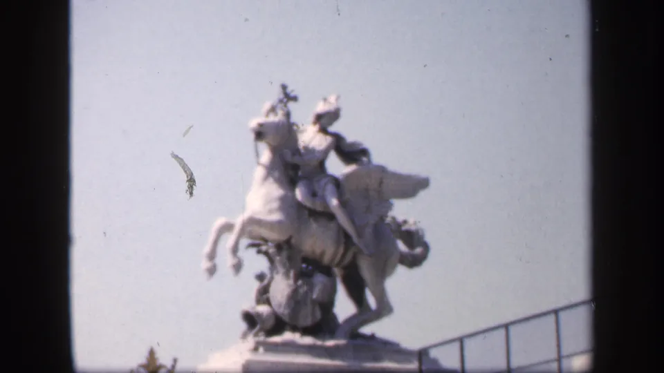 1949 France home-movie close view of an equestrian statue, likely in a Paris landmark setting, isolated against a bright sky.