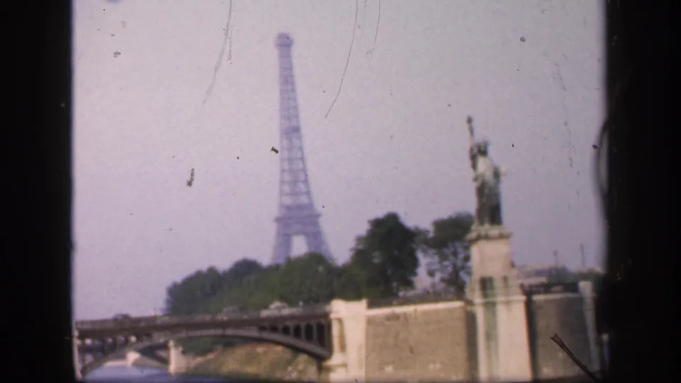 1949 Paris 8mm frame from the Seine with the Eiffel Tower in the background and the Statue of Liberty replica on the right.