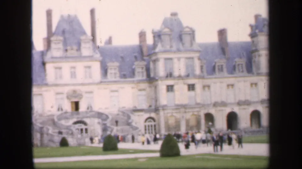 A central section of the castle-like facade appears with visitors on the grounds, consistent with 1949 Ireland travel footage.