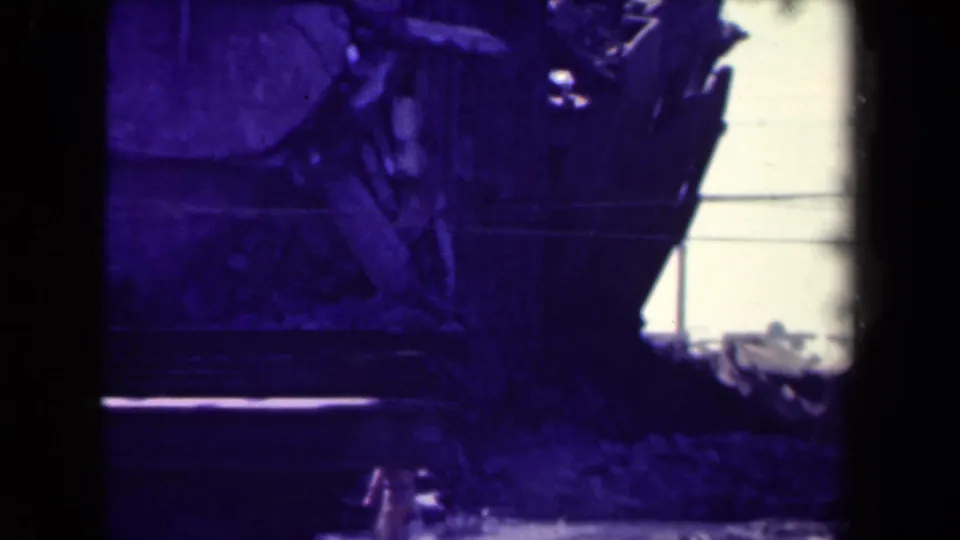 The 1944 Manila view is partly obscured by film framing, showing a vehicle edge, rubble, and the damaged building facade.