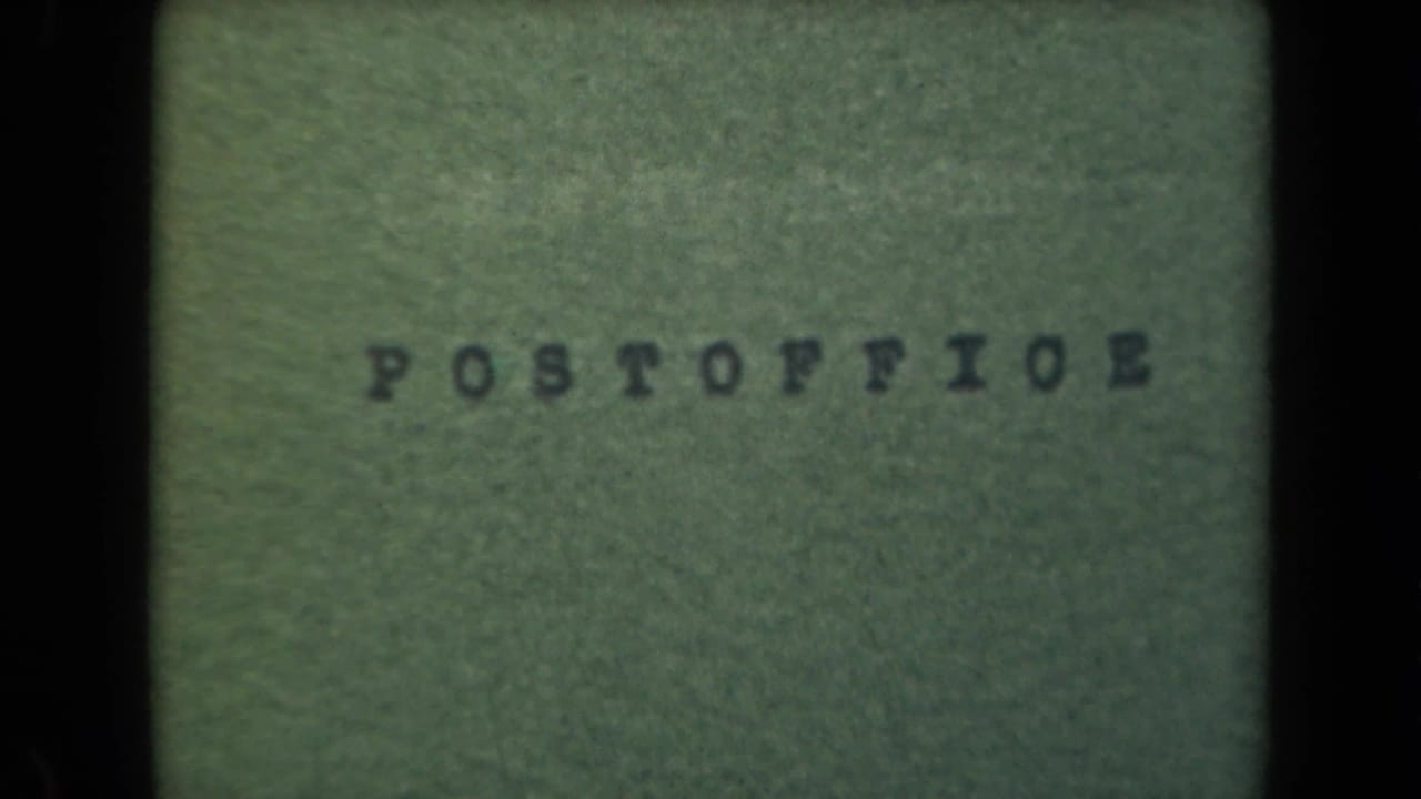 Green textured surface with the typed word POSTOFFICE near the upper center.