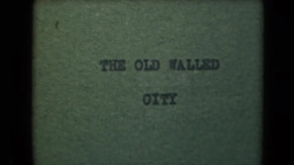 Title card on green background reads THE OLD WALLED CITY, identifying the Manila old walled city location in the supplied clip metadata.