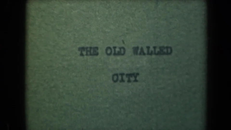 Lower-left contact-sheet frame shows the same old walled city title card with soft type and muted green film color.
