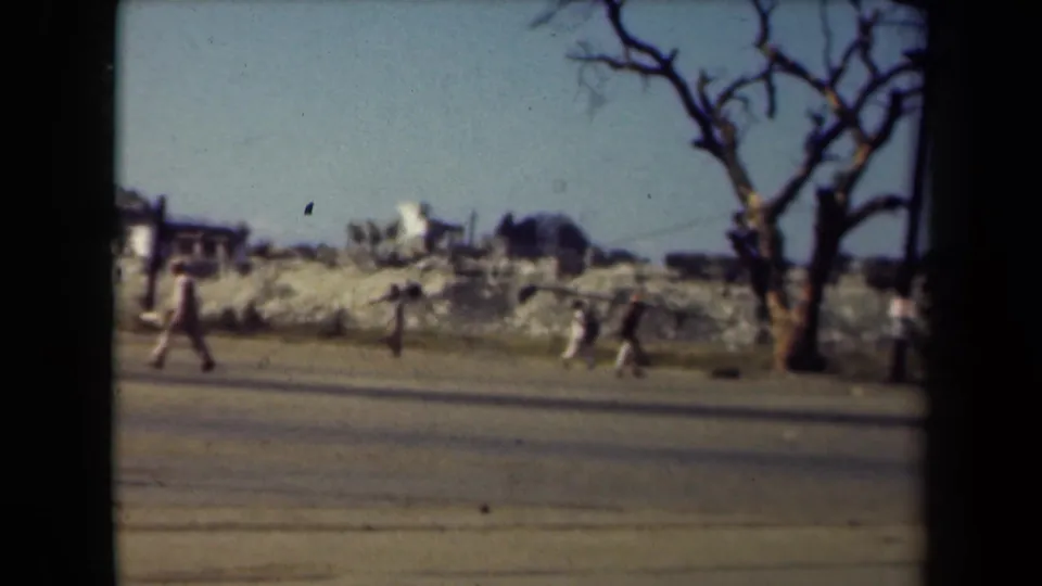 The final frame shows a Manila road scene from 1944 with pedestrians, rubble, a leafless tree, utility poles and damaged buildings.