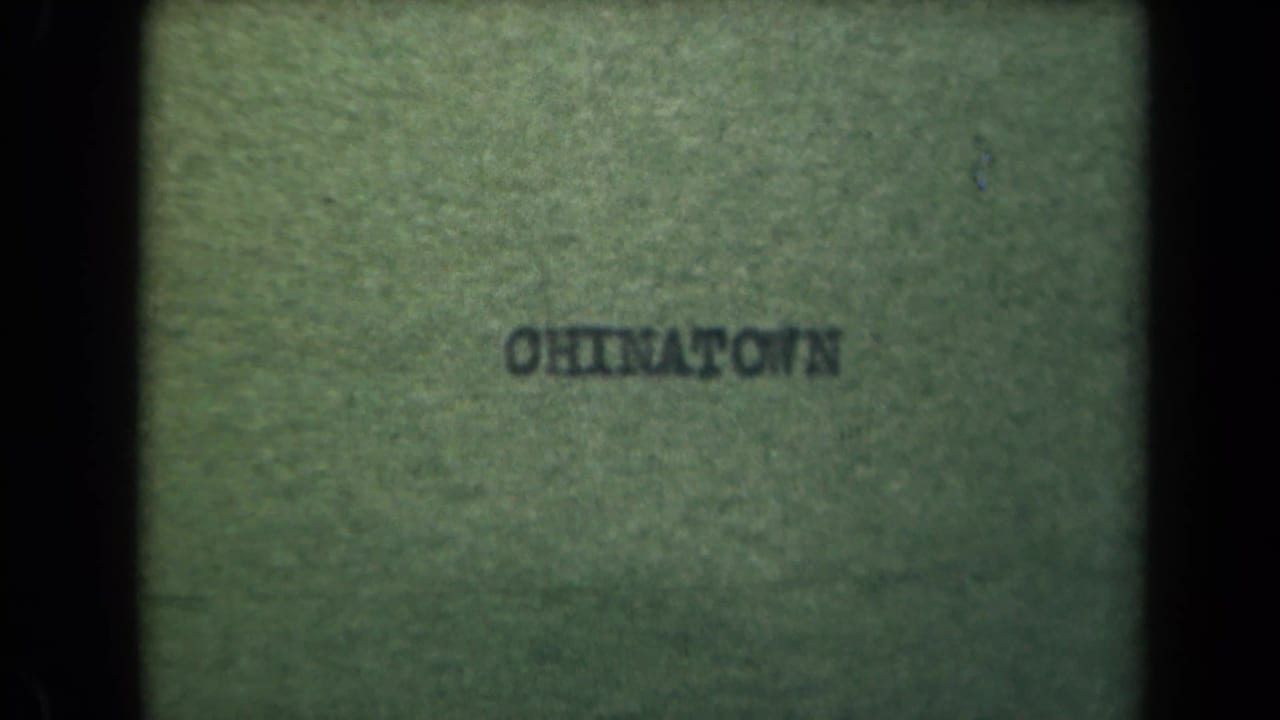 Leader or film edge frame with reversed text and greenish film texture.