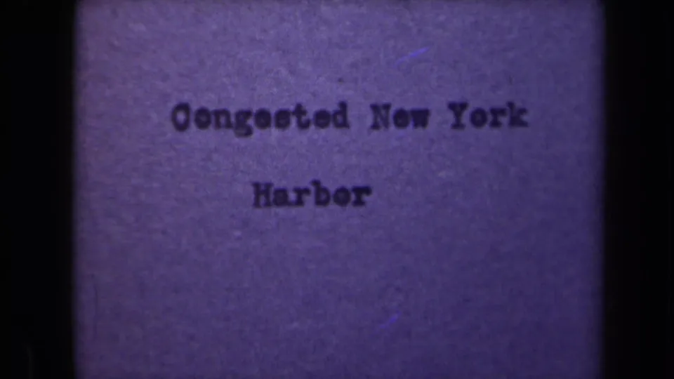 1946 8mm title card for Congested New York Harbor, with dark typed text on a purple film background.