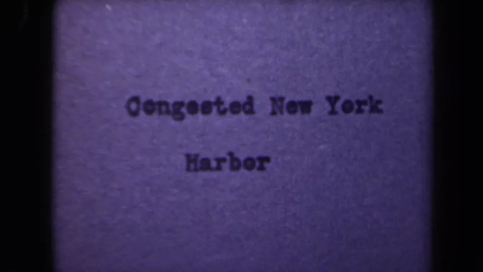 Final sampled title-card frame for Congested New York Harbor, with the lettering lower in the frame and soft 8mm texture.