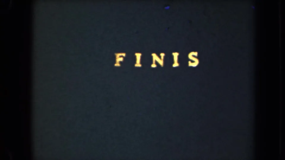 1946 8mm frame from New York with “FINIS” in yellow type near the top of a dark card.