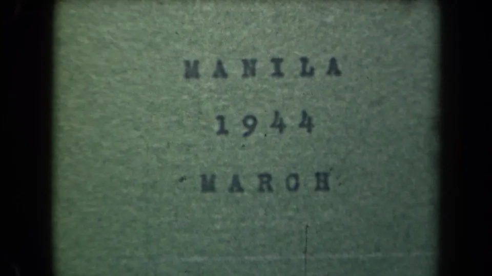 8mm title card for Manila in March 1944, cropped within dark frame edges and softened by grain and exposure variation.