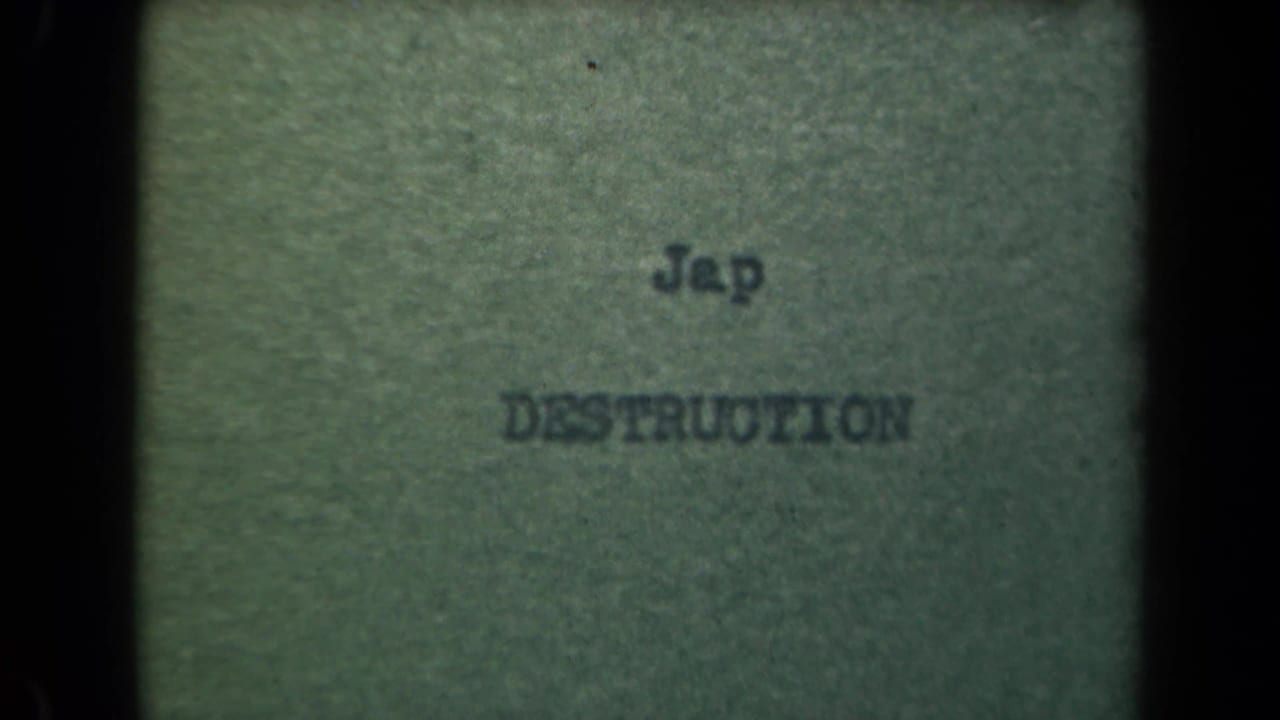 Typed words on greenish paper framed by dark 8mm film edges.