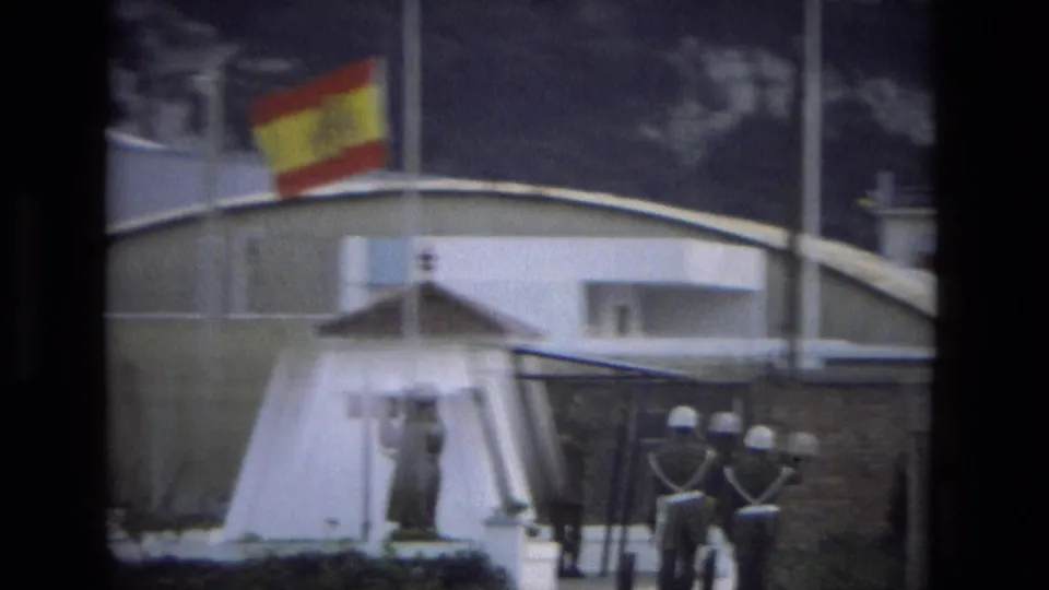 The Spanish flag appears lower on the pole in this 1978 Andalusia frame, with soldiers and a white guard structure below.