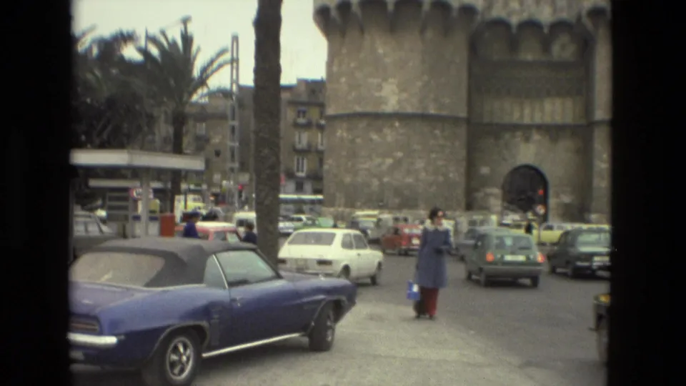 A wider 1978 Andalusia street view shows a blue convertible, vintage cars, pedestrians, palm trees, and a stone tower.