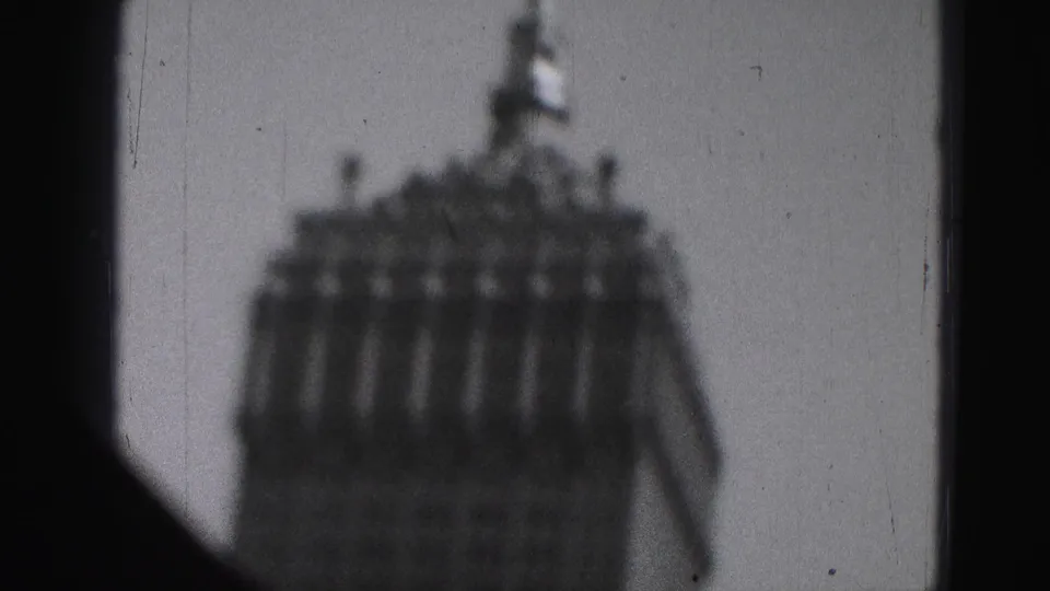 Soft 1946 Harrisburg frame showing a domed building through a moving, grainy black-and-white home-movie view.