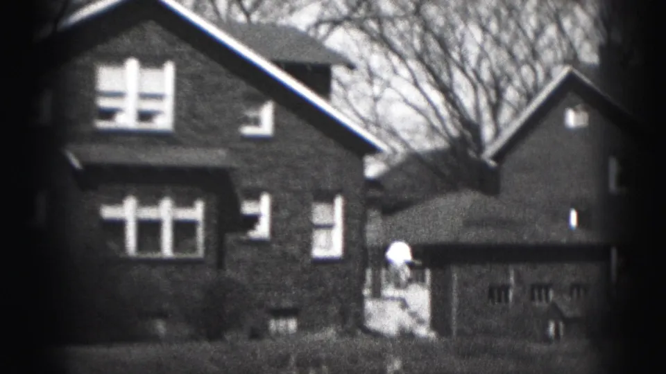 1946 Harrisburg frame showing the brick house, side driveway area, detached garage, and neighboring home.