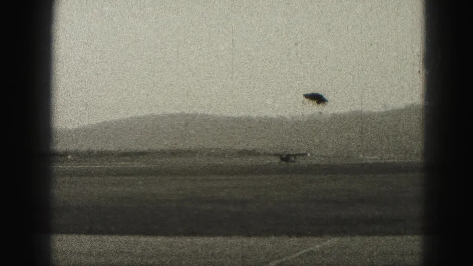 1946 Harrisburg runway takeoff view with the small plane just lifting or climbing low against distant hills.