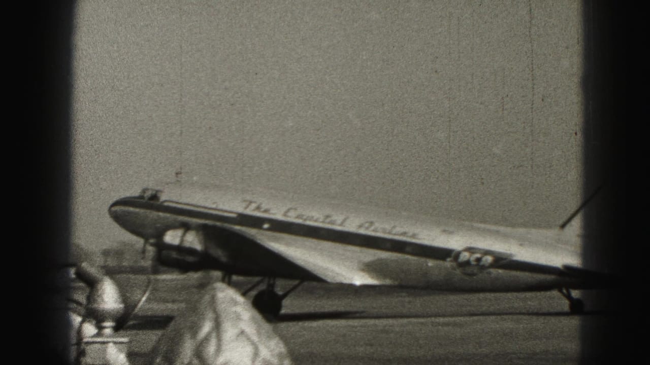 Capital Airlines aircraft on the tarmac with a few people near the lower frame edge.