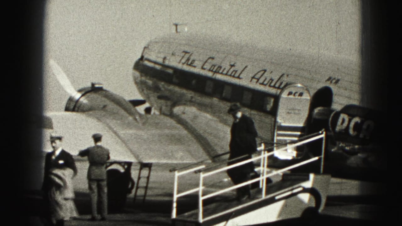 At Harrisburg in 1946, passengers and uniformed staff stand near a Capital Airlines aircraft and portable stairway.