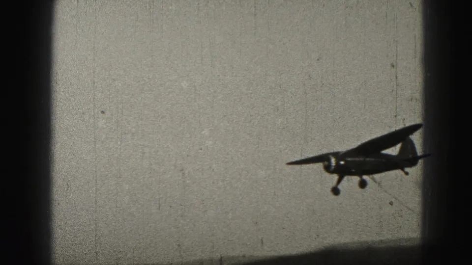 A small high-wing propeller aircraft passes in silhouette against the sky in 1946 Pennsylvania footage.