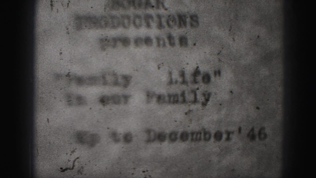 Soft typed home-movie title card with Harrisburg Productions text and quoted family title.