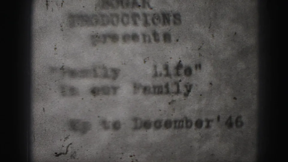 Blurred 1946 Harrisburg home-movie title card with typed production wording, quoted family-life title, film grain, and dark film edges.