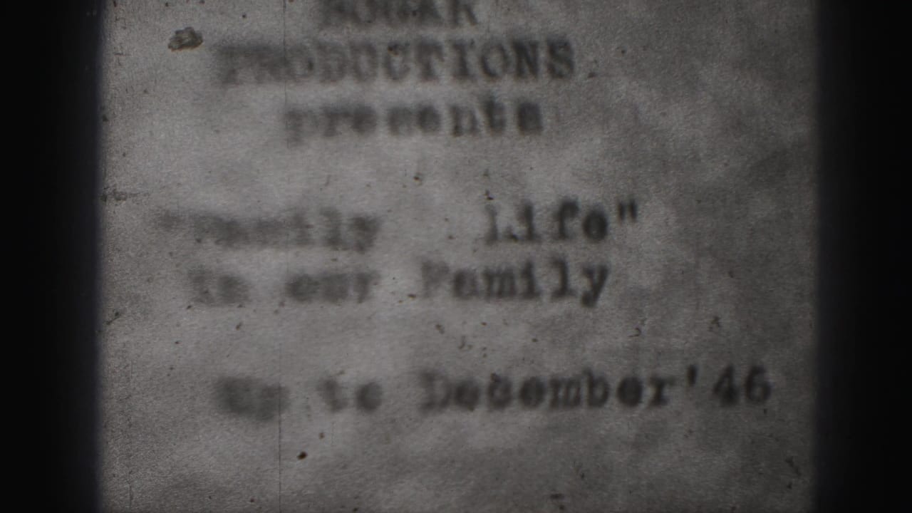 A 1946 Harrisburg family-film title card appears in soft focus, with typed text, a December date line, and a dark vertical gate shadow.