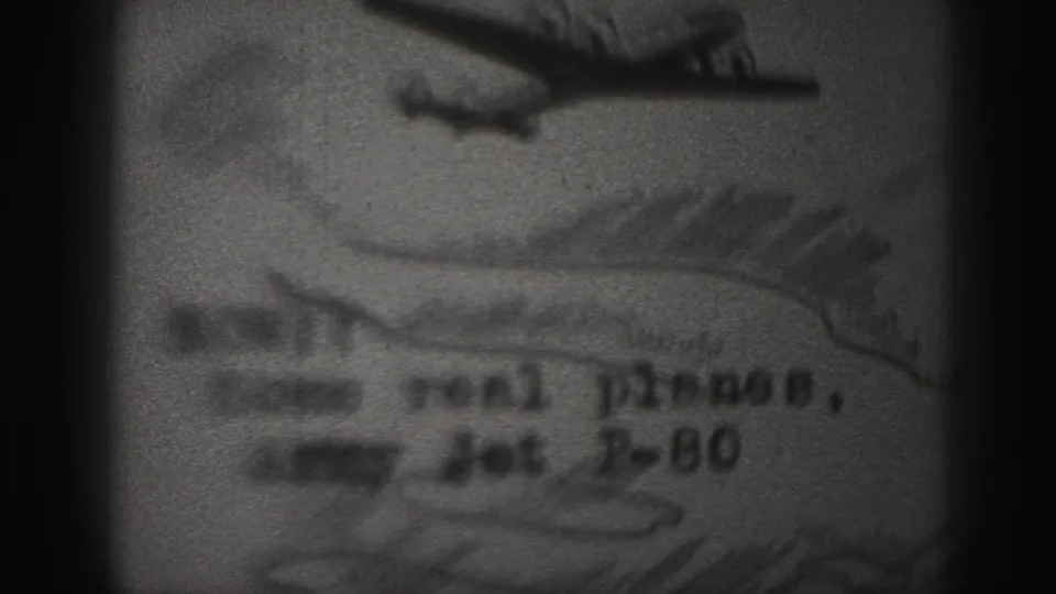 Close-up of a typed note on paper with an airplane-like graphic, including wording that appears to reference planes and an Army jet P-80.