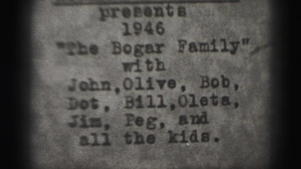 Grainy black-and-white 1946 Bogar Family title card, centered on typed family names within a soft 8mm frame.