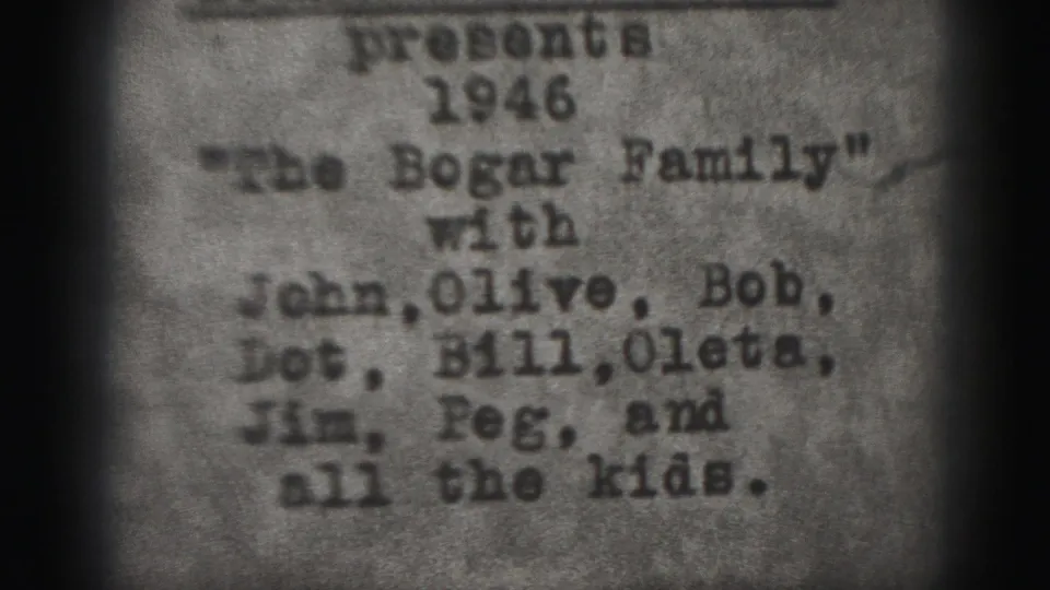 1946 8mm title card from Harrisburg, Pennsylvania, with typewritten text presenting The Bogar Family and several names.