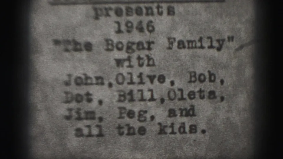 1946 Harrisburg home-movie title card remains on screen, with the typewritten Bogar Family heading and names softened by film grain.
