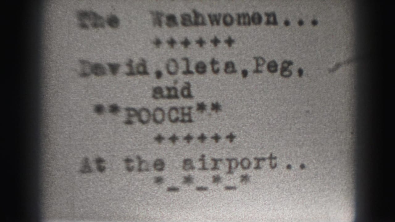 Similar typewritten title card with The Washwomen, cast names, and a line reading at the airport.