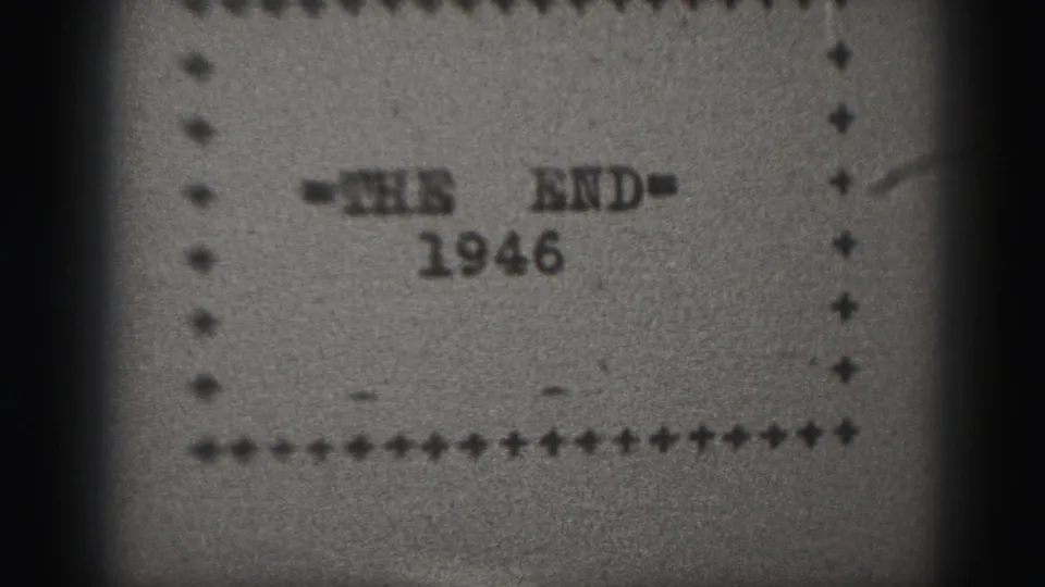 1946 black-and-white 8mm home-movie end card showing '=THE END=' above the year within a dotted border.