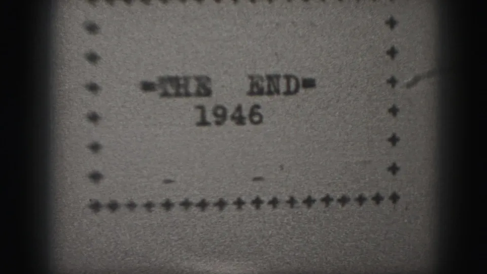 Final 1946 end-card frame from a black-and-white 8mm home movie, with centered text, dotted border, and soft scan texture.