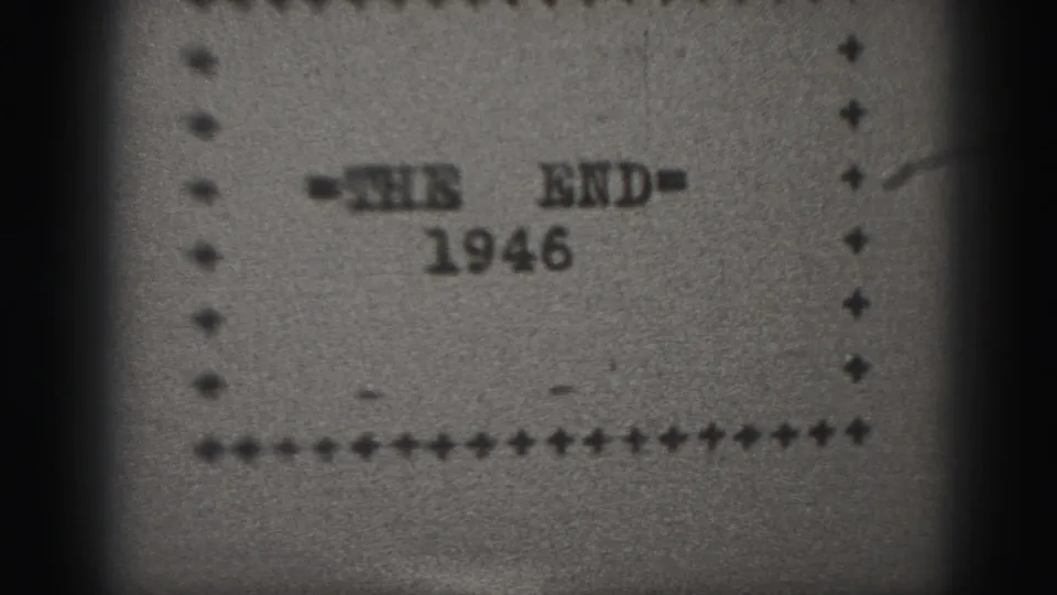 1946 Harrisburg 8mm frame showing a black-and-white THE END title card with a dotted border and soft film grain.