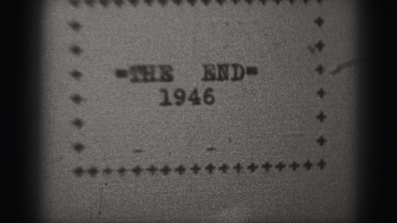 Black-and-white 8mm frame from the 1946 Harrisburg clip showing the THE END card within a dotted border.