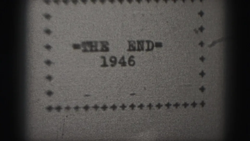 Black-and-white 8mm frame from the 1946 Harrisburg clip showing the THE END card within a dotted border.