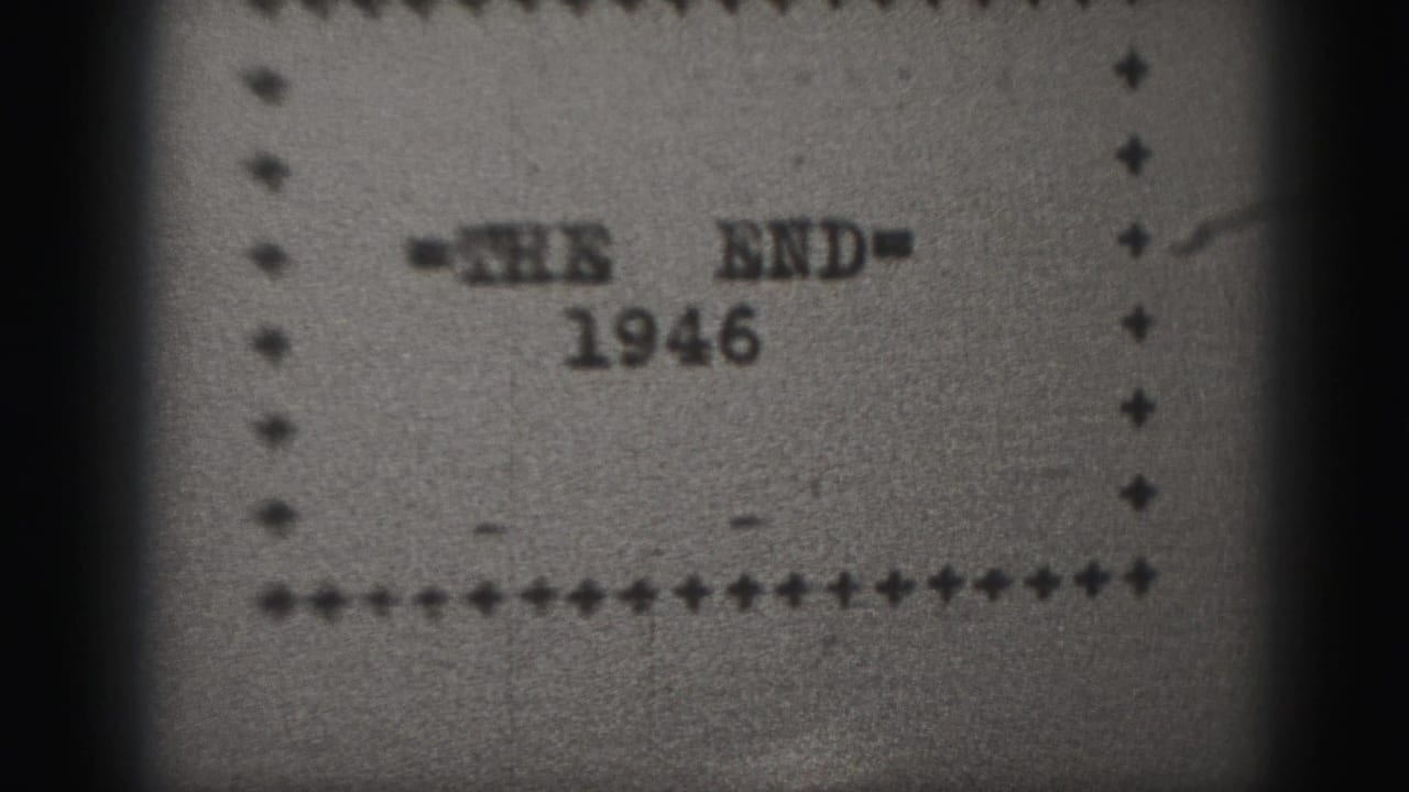 Typewritten '=THE END=' card with 1946 below inside a decorative border.