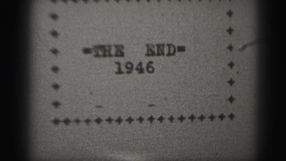 Black-and-white final end-card frame from a 1946 Harrisburg 8mm reel, showing '=THE END=' and the year within a handmade border.