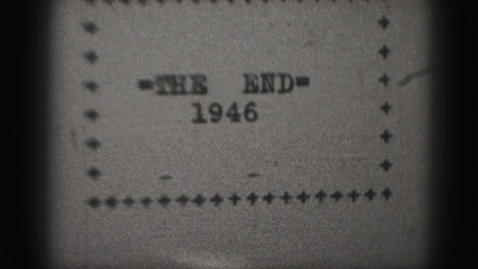 Harrisburg 1946 home-movie end card held on screen, showing typed lettering, border dots, grain, and soft focus.
