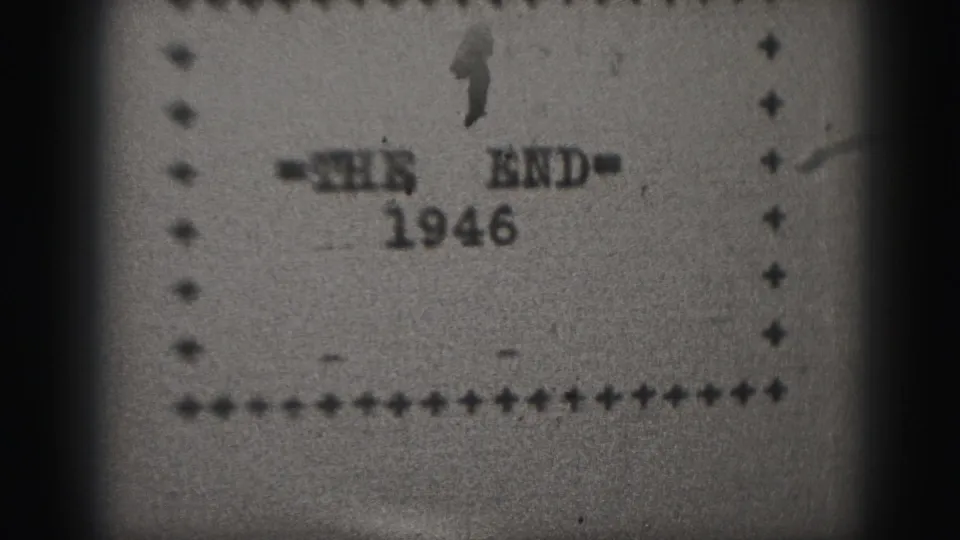 1946 8mm home-movie end card, showing THE END text, the year 1946, film grain, and sprocket-edge shadows.