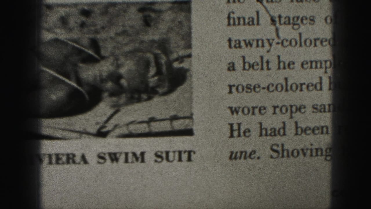 Close-up of a newspaper swimsuit photo and partial caption text behind dark film-gate borders.