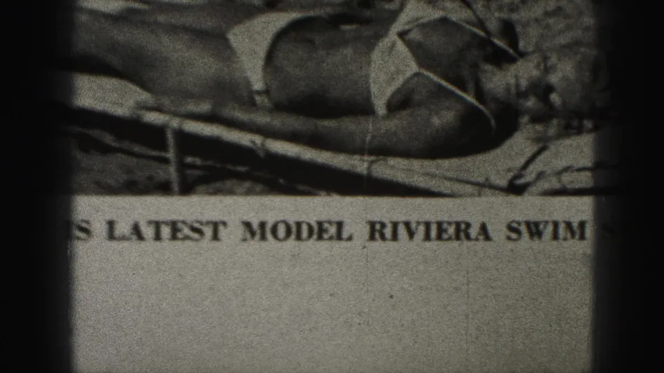 1946 Harrisburg 8mm frame showing a filmed newspaper clipping with a swimsuit model and partial Riviera swimwear headline.