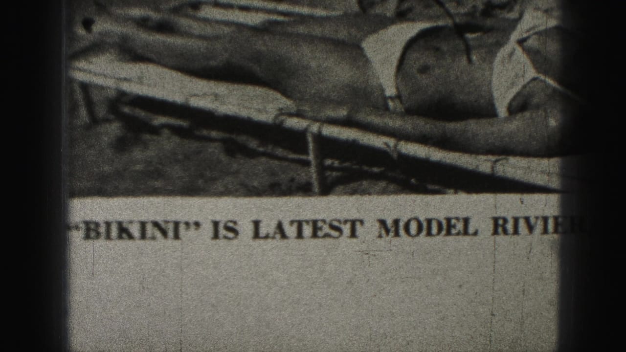 1946 Harrisburg 8mm frame showing a newspaper article with partial text mentioning bikini and a Riviera swim suit.