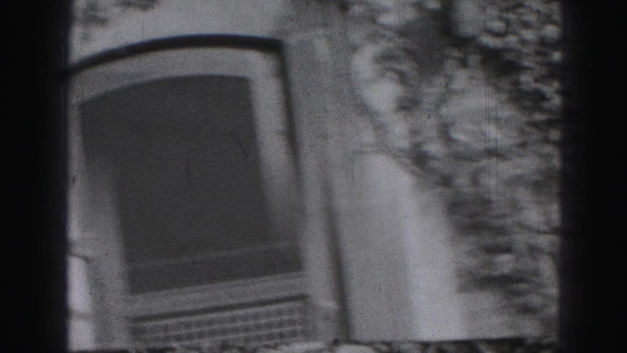 Blurred low-angle view of an arched window and ivy-covered stone wall.