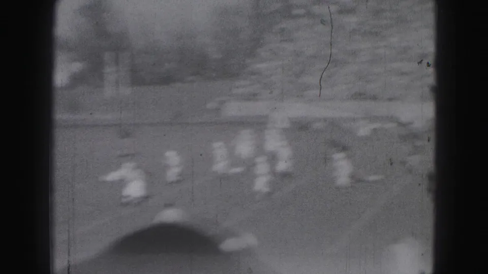 Final 1946 Harrisburg frame showing blurred players near a goal-area section of the crowded sports ground.