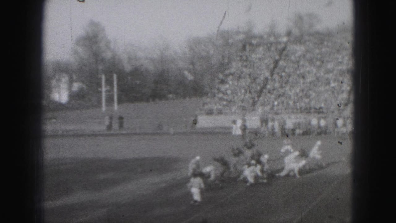 1946 Harrisburg sports footage shows players converging on the field with packed stands in the background.