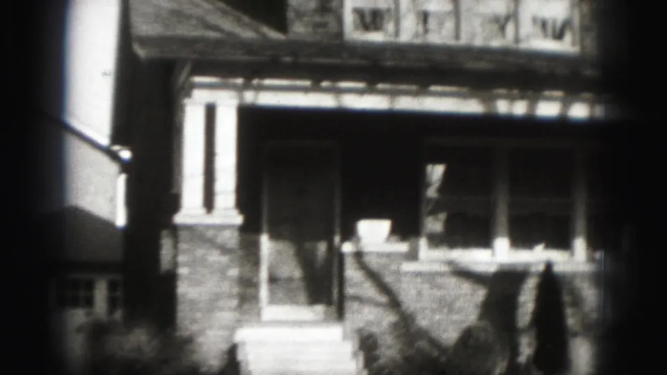 1946 residential exterior in Harrisburg, focused on the porch, front steps, brick lower wall, and neighboring building edge.