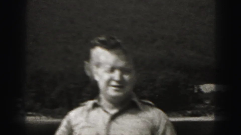 Adult man stands outdoors in a light shirt in 1946 home-movie footage from New Cumberland, Pennsylvania.