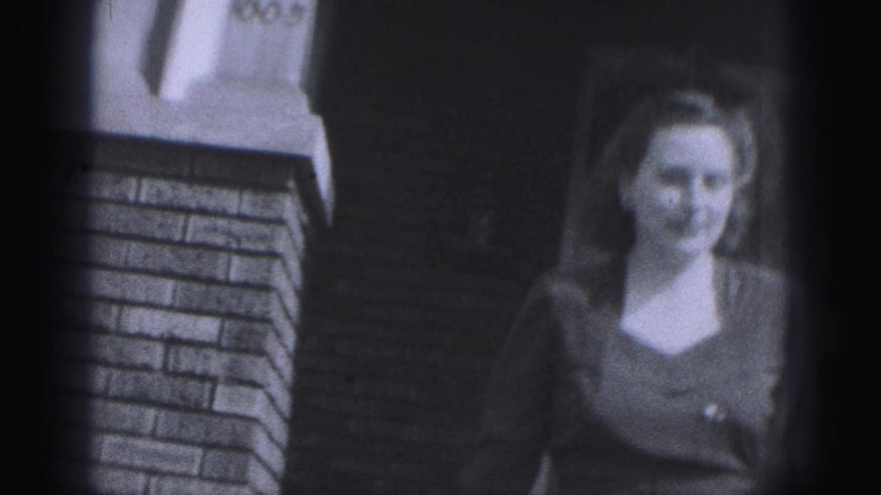 A distant, softer frame shows a woman in a darker outfit near brickwork, likely from the same 1946 New Cumberland home-movie sequence.
